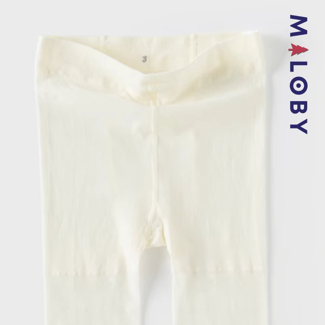 Collants fins unis beige pour fille, idéal pour vêtements enfants et anniversaires.
