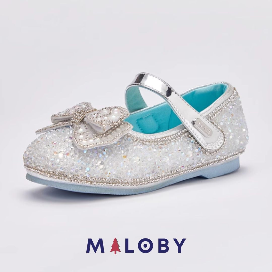 Babies de cérémonie à nœud pour fille en argent, parfaits pour événements et anniversaires.