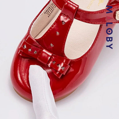 Bottines en cuir rouges à nœud pour fille, idéales pour les enfants et les occasions spéciales.