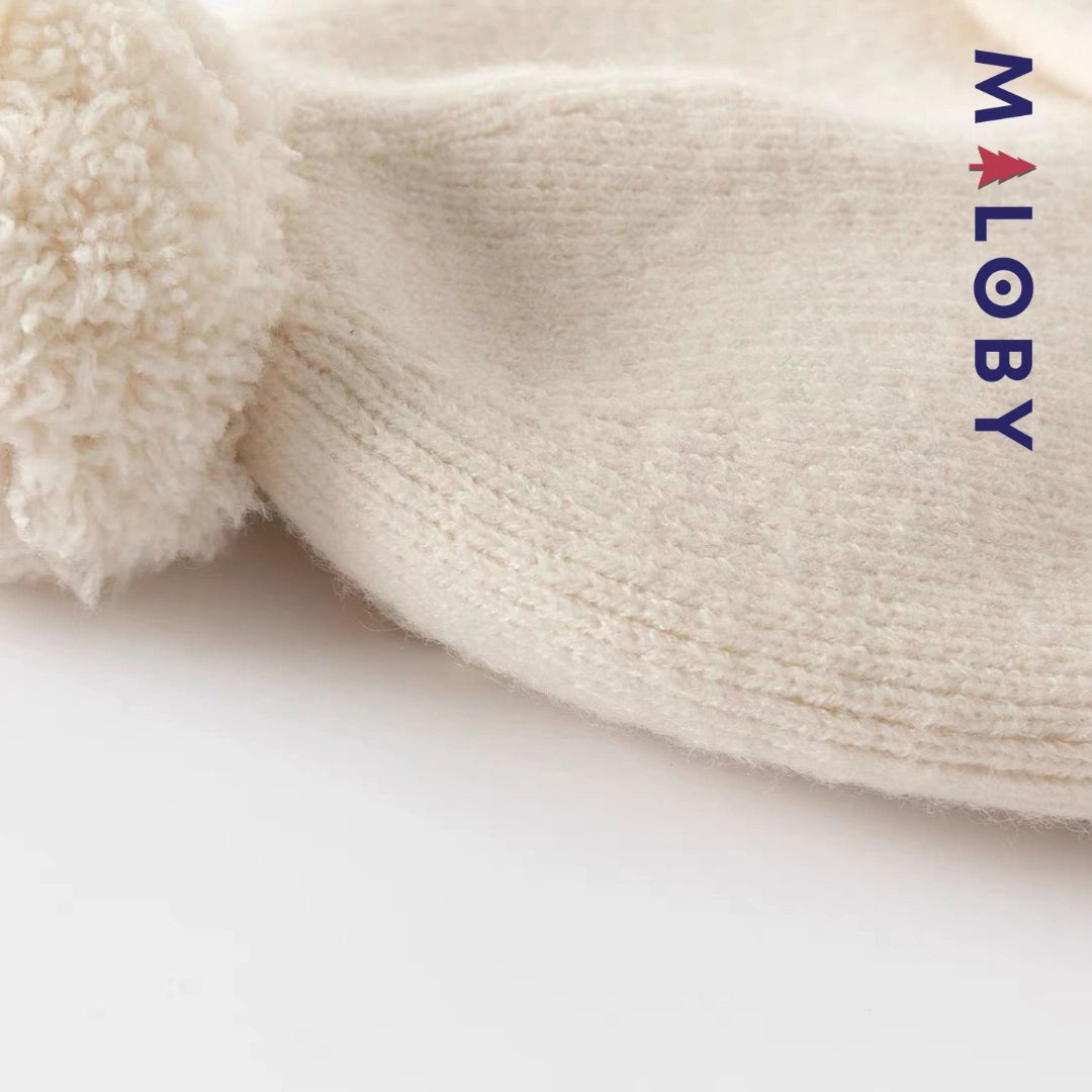 Bonnet en maille beige pour enfant garçon, accessoire tendance et confortable.