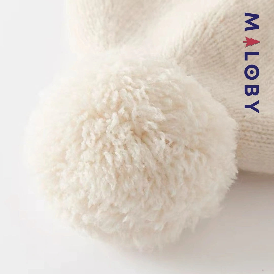 Bonnet en maille beige pour enfant garçon, accessoire tendance et confortable.