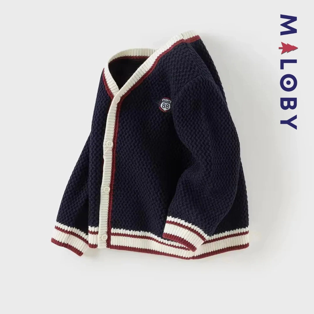 Cardigan en maille marine pour garçon, parfait pour les vêtements enfants au Maroc.