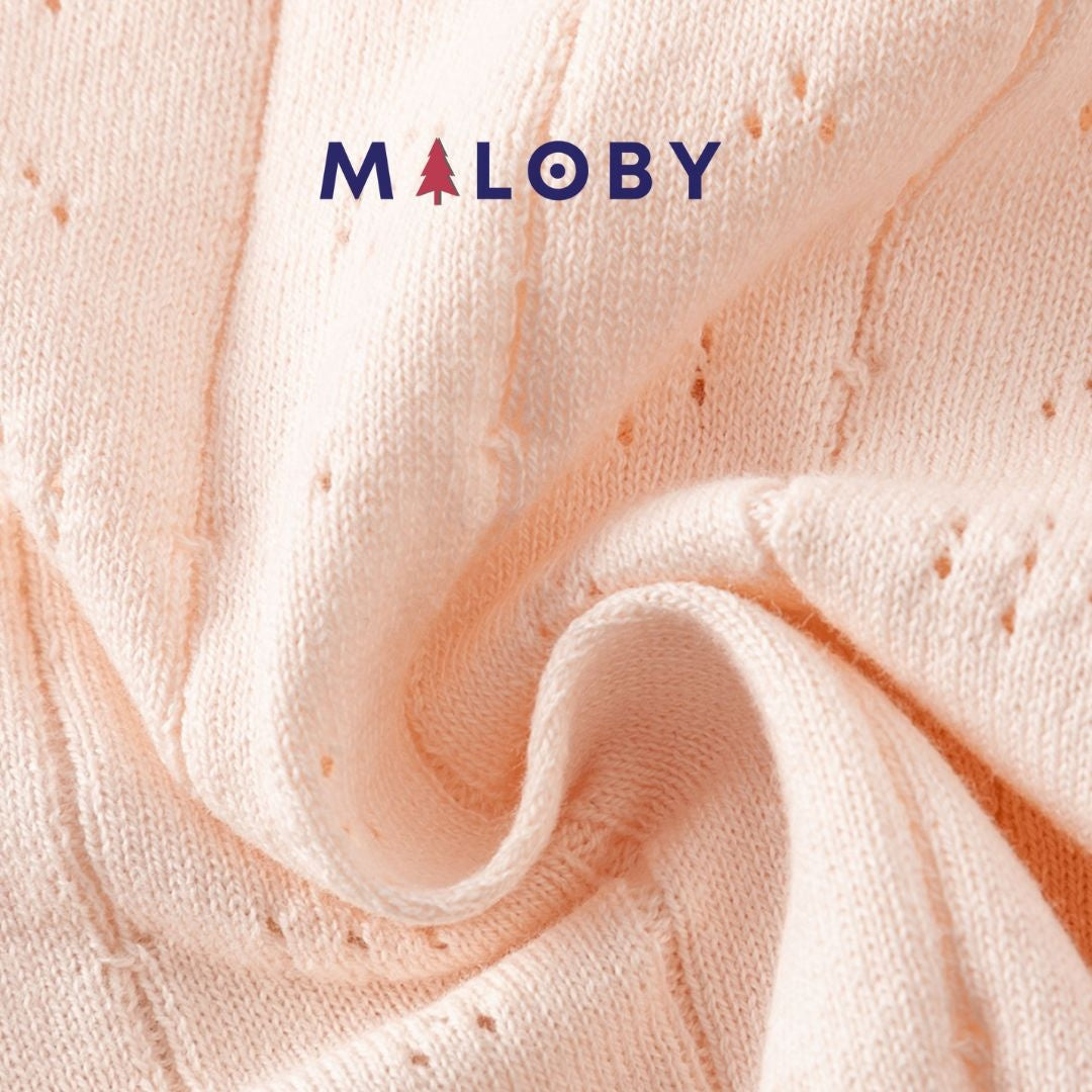 Cardigan en maille pointelle corail pour fille, parfait pour les vêtements enfants.