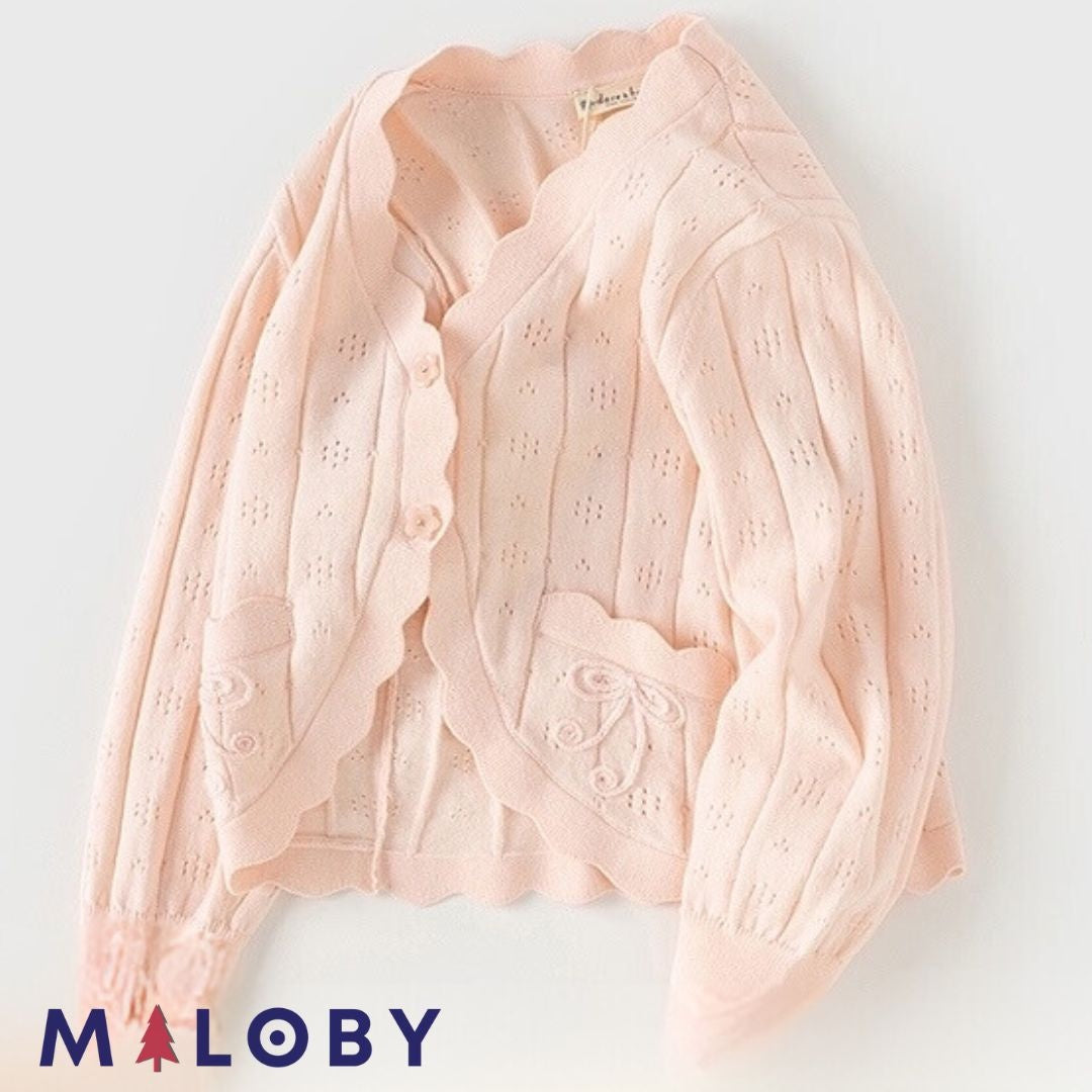 Cardigan en maille pointelle corail pour fille, parfait pour les vêtements enfants.