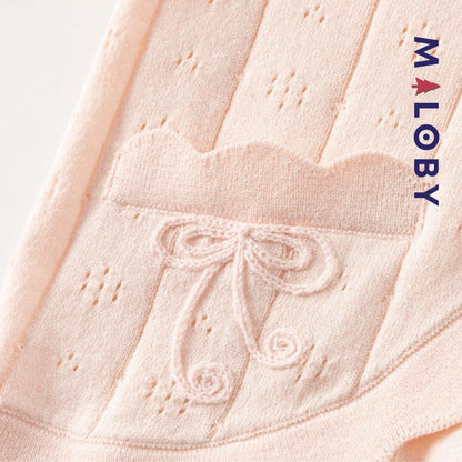 Cardigan en maille pointelle corail pour fille, parfait pour les vêtements enfants.
