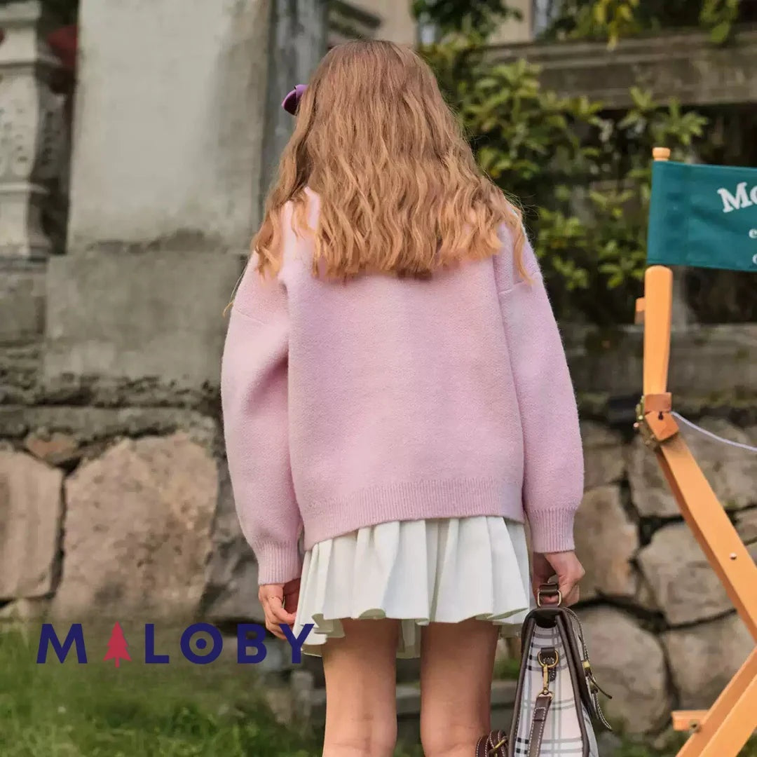 Cardigan mauve motifs cœurs irisés pour fille, idéal pour les vêtements d'enfants au Maroc.