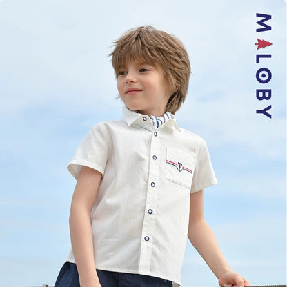 Chemise blanche motifs marins pour garçon, parfaite pour les fêtes et occasions spéciales.