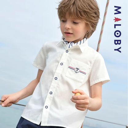 Chemise blanche motifs marins pour garçon, parfaite pour les fêtes et occasions spéciales.