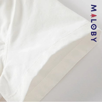 Chemise blanche motifs marins pour garçon, parfaite pour les fêtes et occasions spéciales.