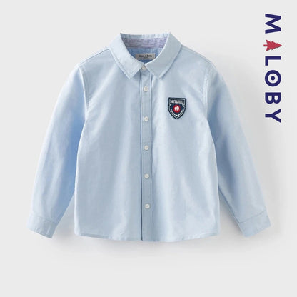 Chemise en pur coton bleu ciel pour garçon, idéale pour les anniversaires et les occasions spéciales.