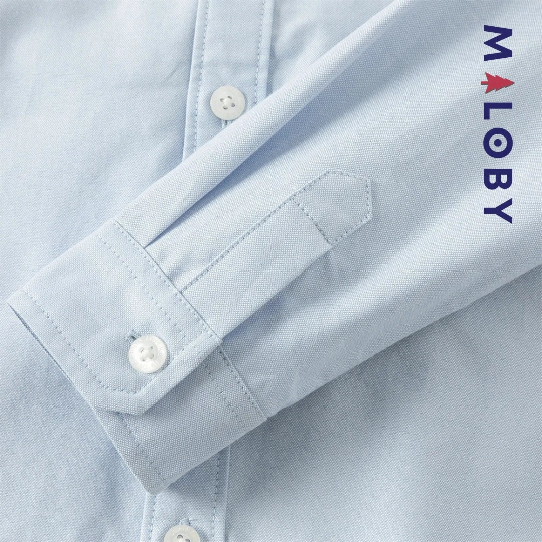 Chemise en pur coton bleu ciel pour garçon, idéale pour les anniversaires et les occasions spéciales.