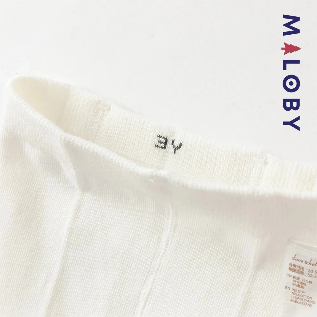 Collant épais fantaisie beige pour petite fille, idéal pour les vêtements enfants.