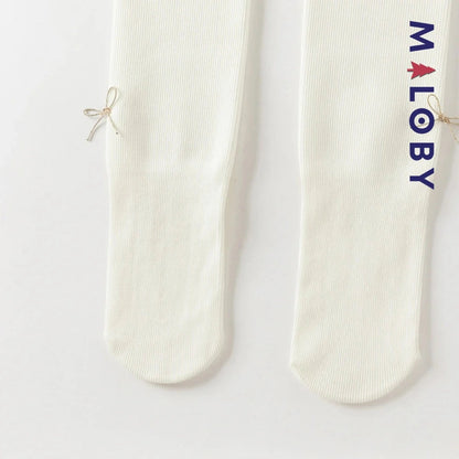 Collant épais beige et noir avec nœuds pour fille, parfait pour enfants et anniversaires.