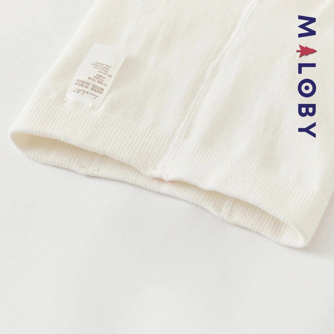 Collants épais à pois et nœud fantaisie pour fille en beige, parfaits pour les vêtements d'enfants.