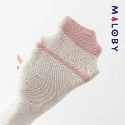 Collants épais à pois et nœud fantaisie pour fille en beige, parfaits pour les vêtements d'enfants.
