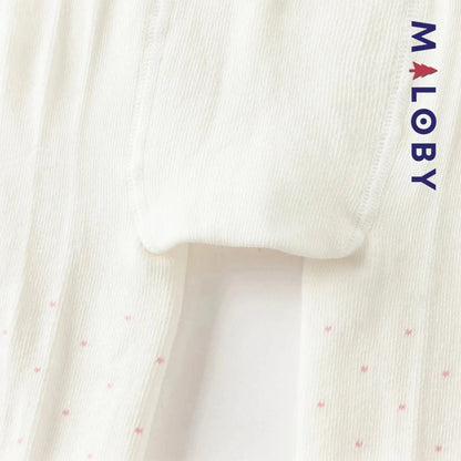 Collants épais à pois et nœud fantaisie pour fille en beige, parfaits pour les vêtements d'enfants.