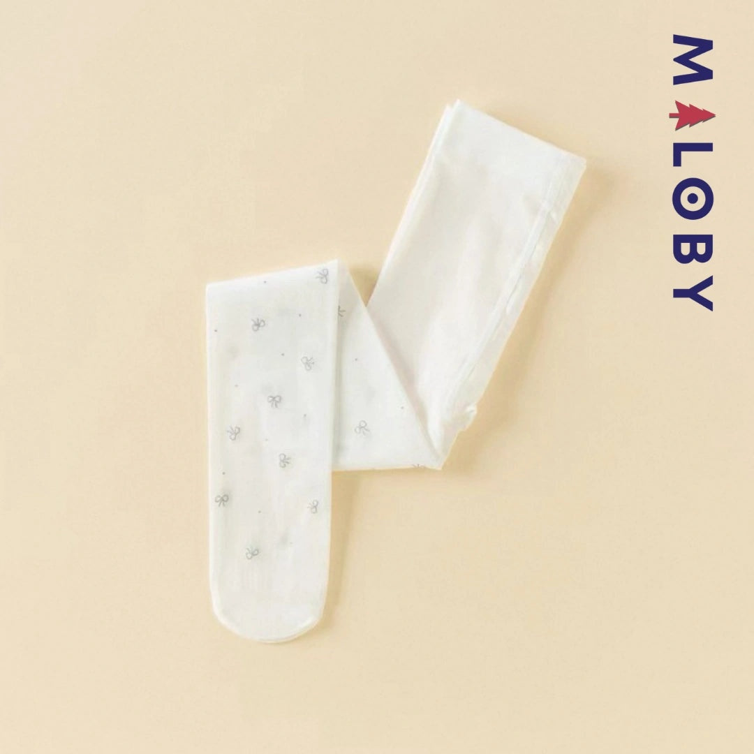 Collants fins blancs avec motifs nœuds argentés pour fille, parfaits pour les vêtements d'anniversaire.