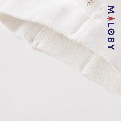 Collants fins blancs à motif pompons pour fille, parfaits pour les occasions spéciales.