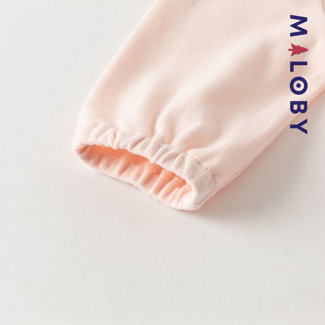 Combinaison antibactérienne rose pour bébé fille, idéale pour les vêtements enfants et les occasions spéciales.
