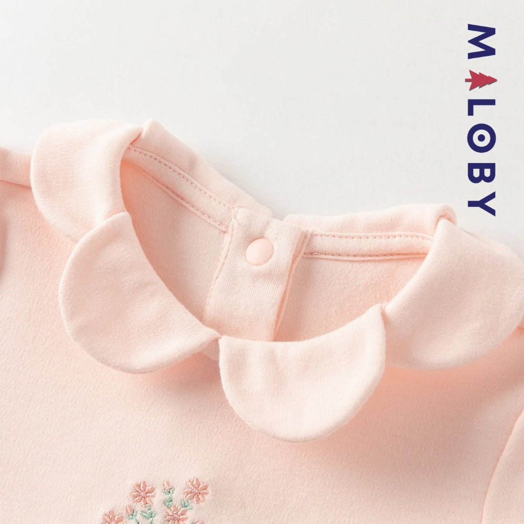 Combinaison antibactérienne rose pour bébé fille, idéale pour les vêtements enfants et les occasions spéciales.