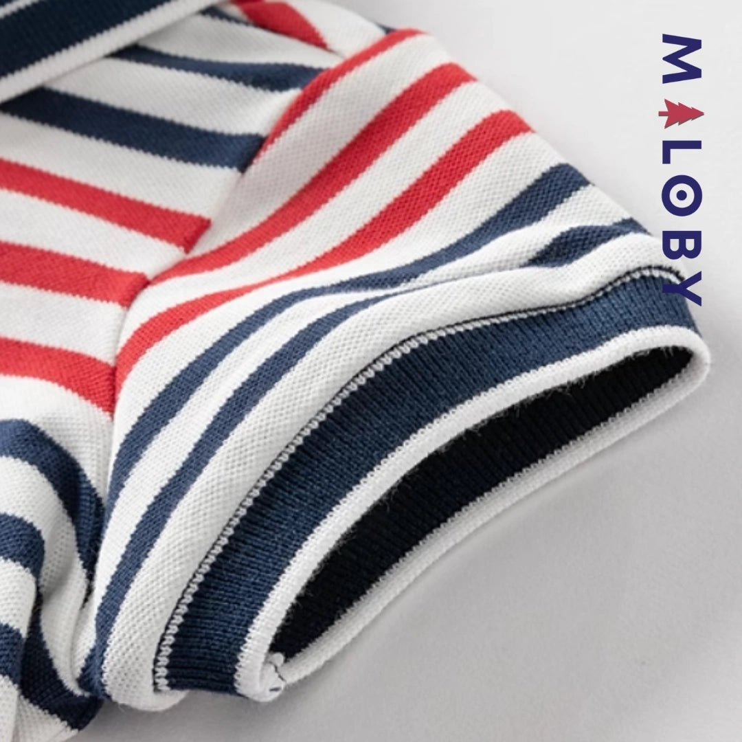 Combinaison bébé garçon rouge rayé, idéale pour anniversaires et événements spéciaux.