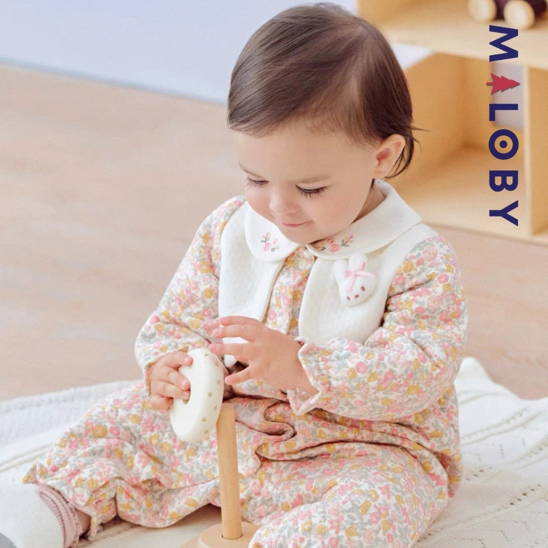 Combinaison habillée motif floral pour bébé fille en rose, idéale pour les anniversaires.