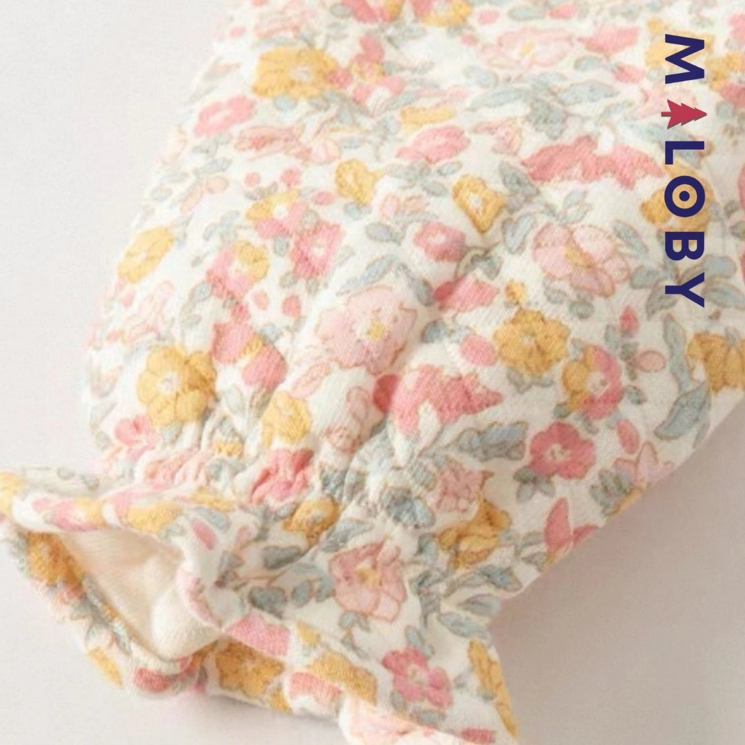 Combinaison habillée motif floral pour bébé fille en rose, idéale pour les anniversaires.