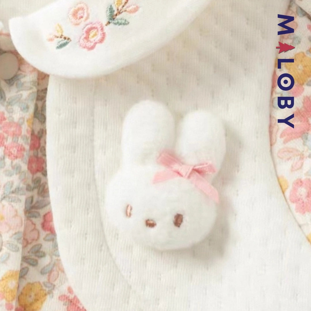 Combinaison habillée motif floral pour bébé fille en rose, idéale pour les anniversaires.