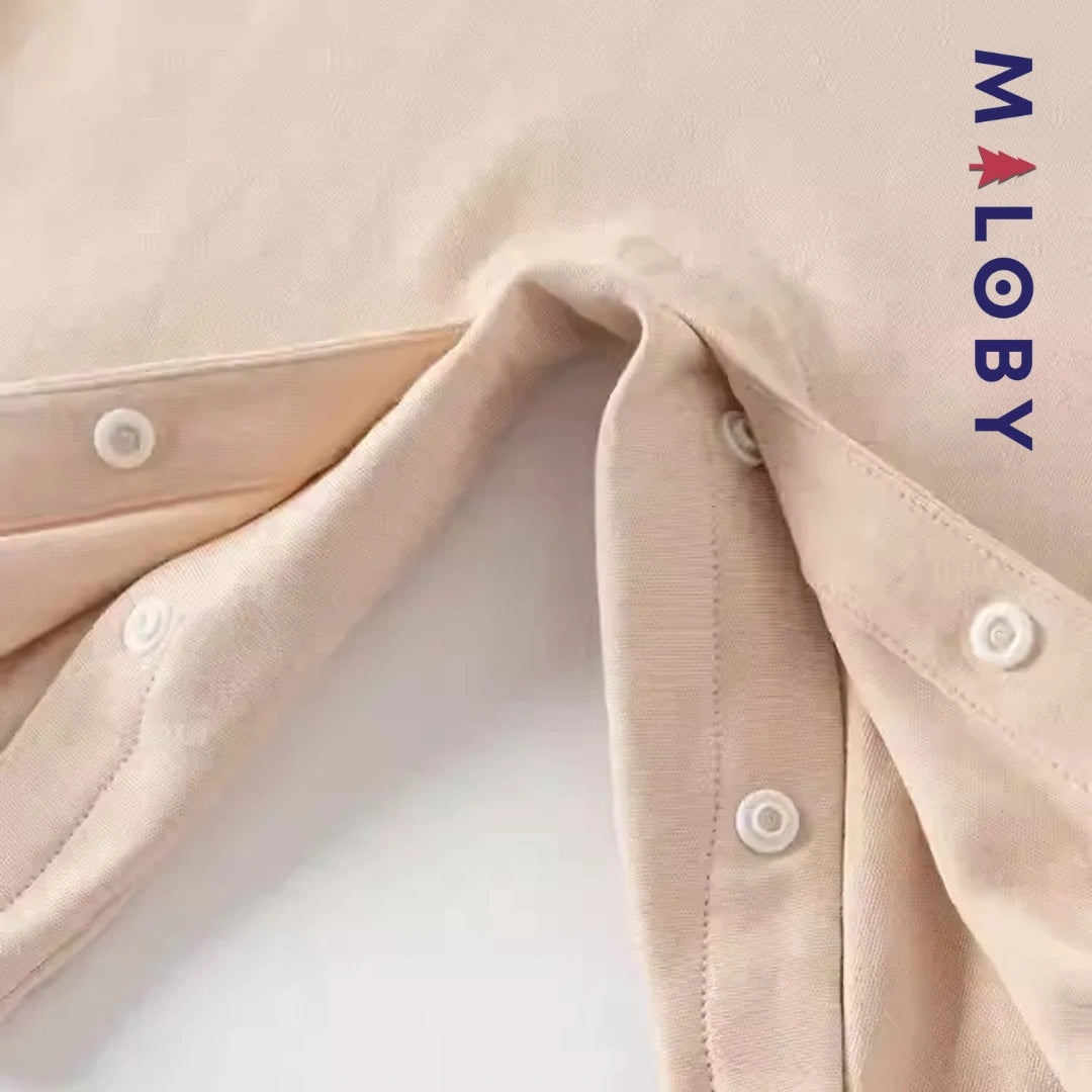 Combinaison longue beige à motif éléphant pour garçon, idéale pour les vêtements d'anniversaire des enfants.