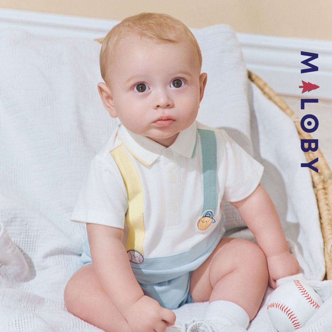 Combishort bébé garçon en piqué de coton blanc, parfait pour les occasions spéciales.