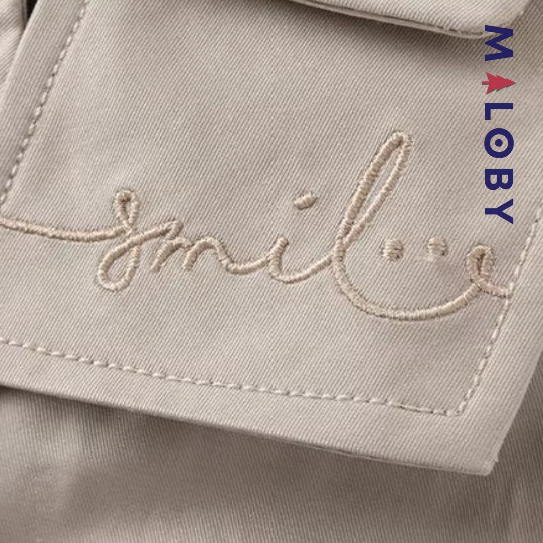 Trench uni beige pour fille, idéal pour les vêtements enfants et les anniversaires.