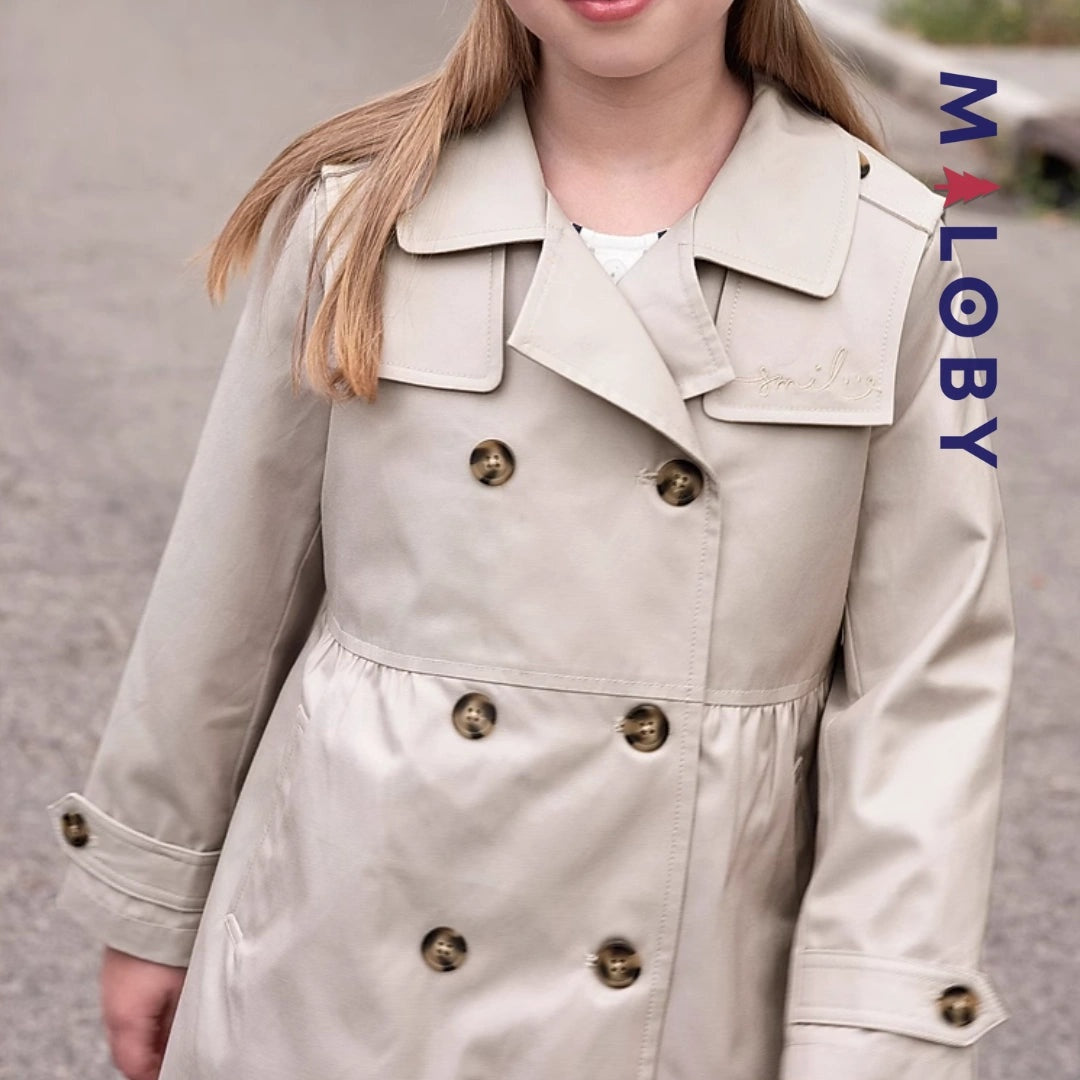 Trench uni beige pour fille, idéal pour les vêtements enfants et les anniversaires.