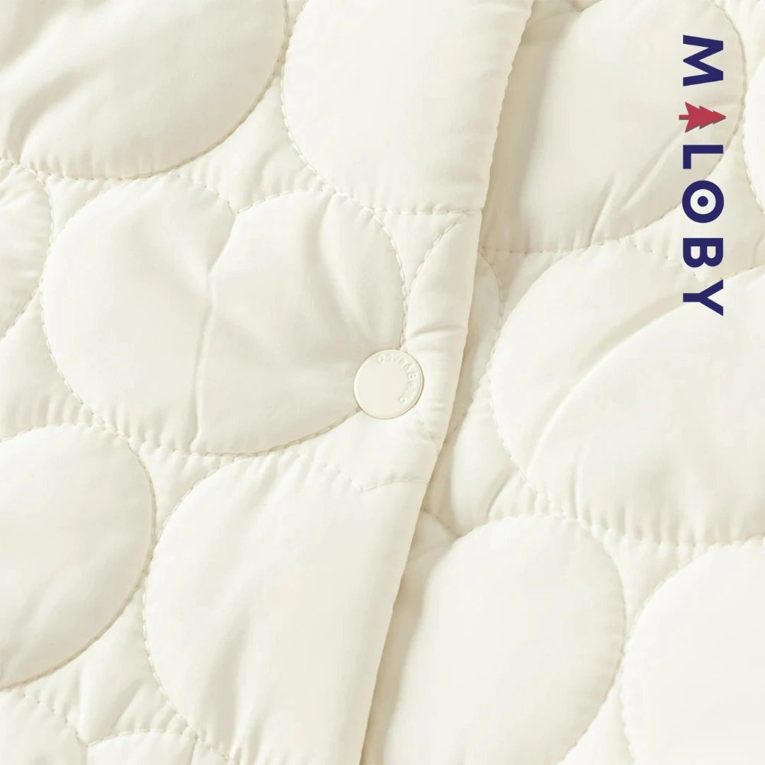 Veste courte matelassée beige pour fille, idéale pour enfants sensibles