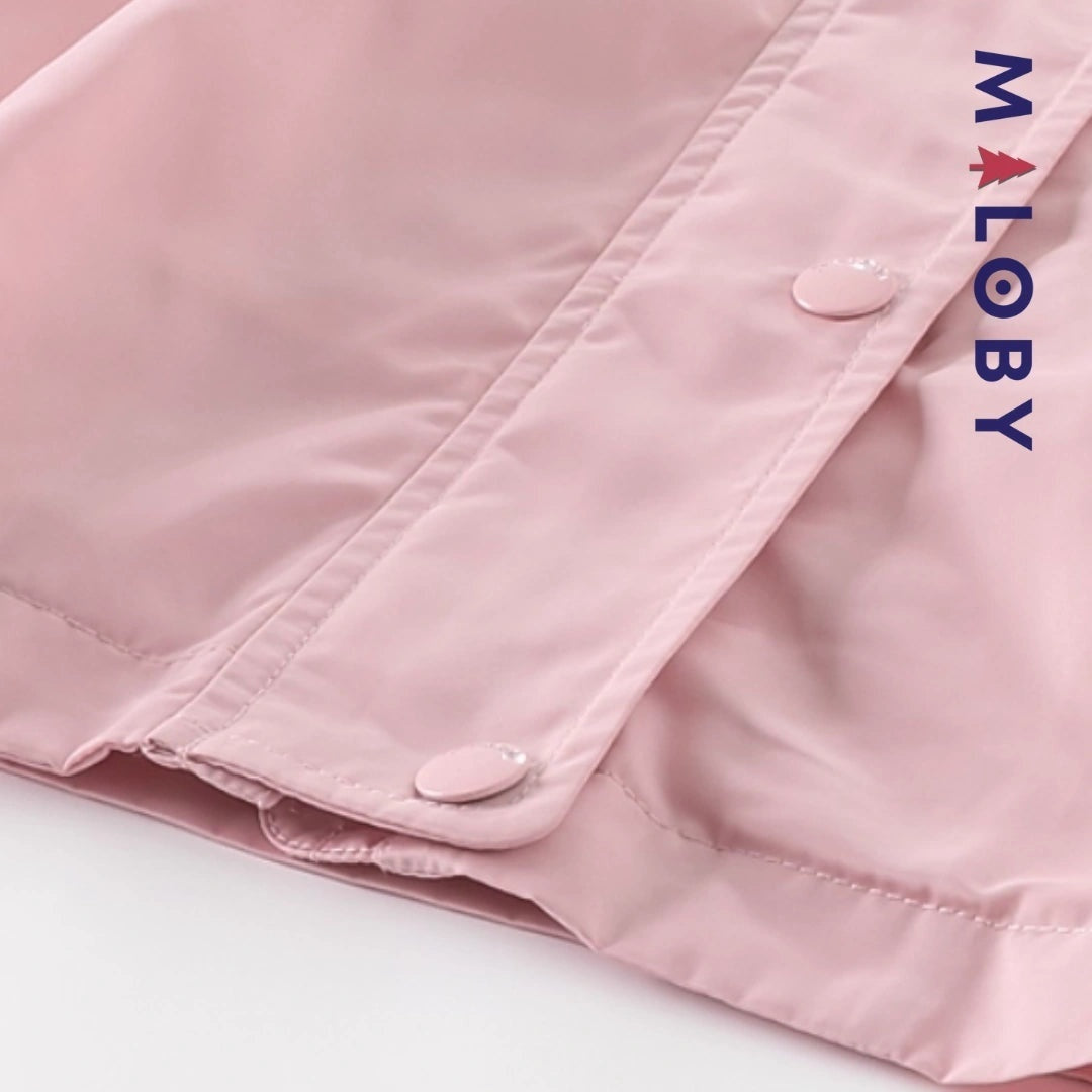 Veste imperméable rose pour enfant fille, idéale pour la mi-saison et les activités en extérieur.
