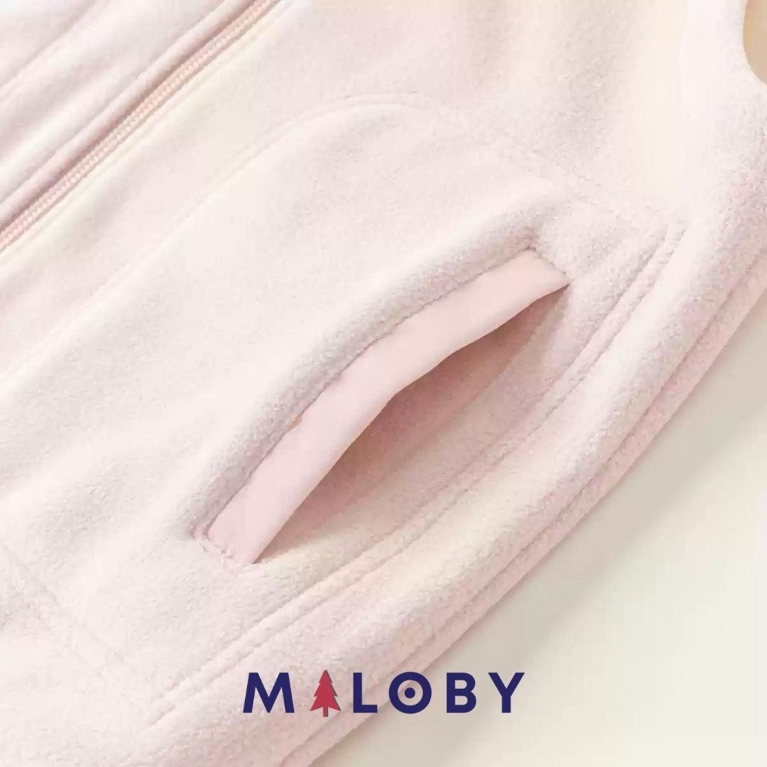 Veste sans manches en sherpa enfant fille rose, idéale pour les vêtements anti-allergiques.