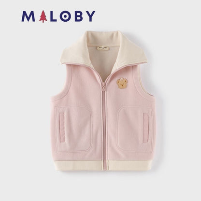 Veste sans manches en sherpa enfant fille rose, idéale pour les vêtements anti-allergiques.